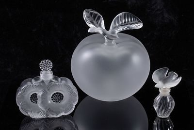 LALIQUE FRENCH CRYSTAL PERFUME AND COLOGNE BOTTLES. The collection of Grand Pomme, Deux Fleurs 