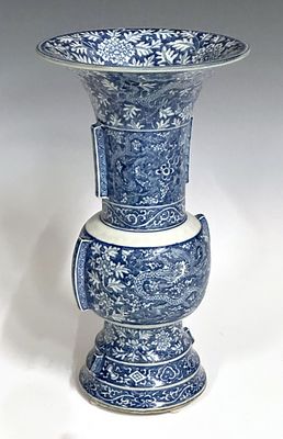 A KANGXI CHINESE BLUE AND WHITE ARCHAISTIC GU-FORM VASE. The central boss decorated on each side 