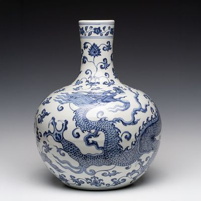 A LARGE CHINESE DRAGON AND FLORAL PORCELAIN BOTTLE VASE. The large globular body rising to a 