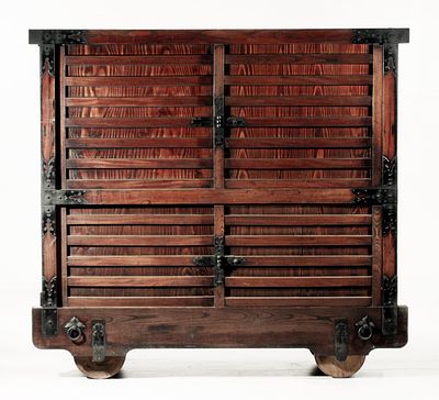A MONUMENTAL 19TH CENTURY JAPANESE 60-INCH KURUMA DANSU. The massive chest on wheels with 