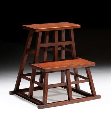 A JAPANESE MORTISE AND TENON TRELLIS FORM STEP STOOL. The two-tier stool with red stain, mortise 