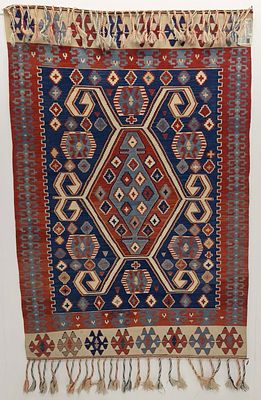 A FINE MODERN TURKISH KELIM, CENTRAL TURKIYE. The red, white and blue kelim with latch hooked 
