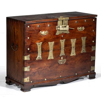 A 19TH CENTURY KOREAN BRASS BOUND CABINET. With dovetailing along the top corner of each side 