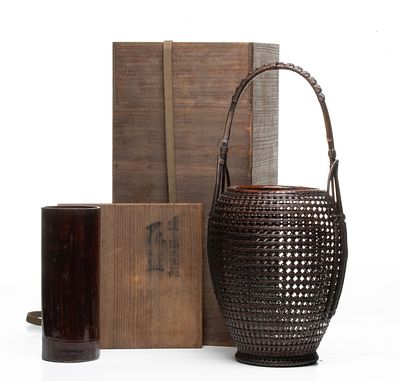 TANABE CHIKUUNSAI BASKET WITH TOMOBAKO, ADAIR ESTATE. The statuesque honeycomb mesh basket 