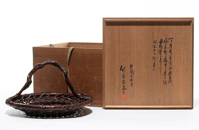 AN UNUSUAL FLOWER ARRANGING BASKET SIGNED CHIKUBOSAI I. The wide, shallow circular floral 