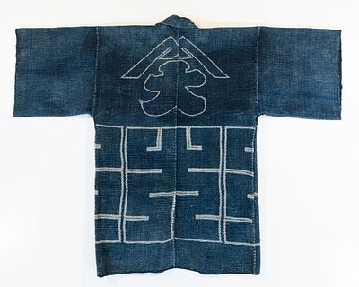 A JAPANESE FIREMAN'S COAT WITH CREST, ADAIR ESTATE. The 19th century firefighter's jacket is 