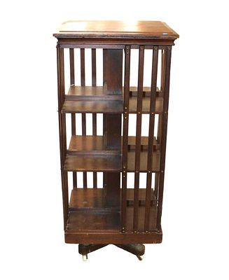 Antique oak revolving bookcase in original finish. In as found condition with finish loss on