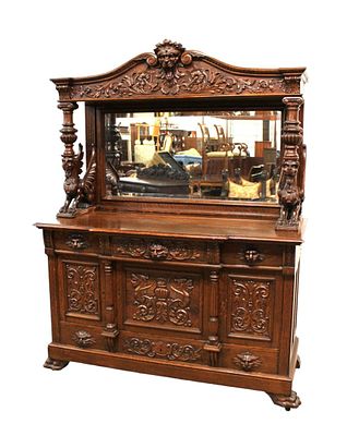 Awesome antique wing griffin buffet with mirrored top. Awesome antique oak carved wing griffin