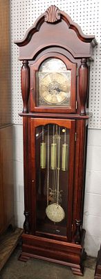 Mahogany Finish Grandfather Style Clock. Mahogany finish grandfather style clock with weights
