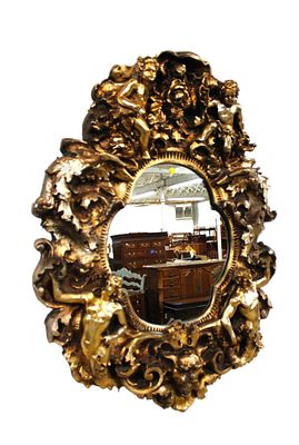 Hanging mirror: carved cherubs, griffin, woman, men. Highly carved and ornate decorator mirror