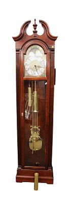 Howard Miller grandfather clock, cherry tall case, with weights and pendulum. Howard Miller