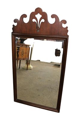 Baker traditional beveled glass mirror, solid mahogany in good condition. Baker traditional 