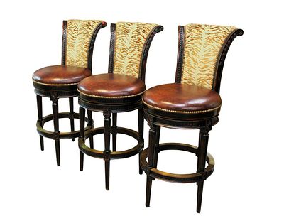 Set 3 Parma P.A.M.A. quality swivel stools, leather and upholstered, with brass capped foot rests. 