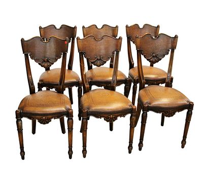 Set 6 Theodore Alexander leather chairs, mahogany framed, industrial tacking, good condition. Set 
