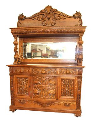 Antique highly carved and ornate Wing Griffin oak buffet with mirror back 1 drawer hutch top