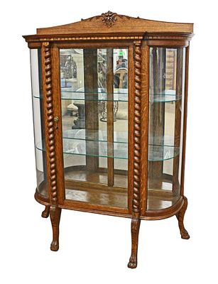 Nice antique oak 1 door curved crystal cabinet with glass shelves, has been refinished approx.