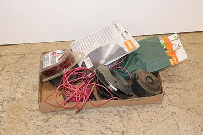 Box of weed trimmer accessories
