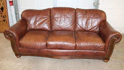 Nice leather 3 cushion sofa with carved mahogany arms and tacking approx. 87" w x 40" d x 36" h