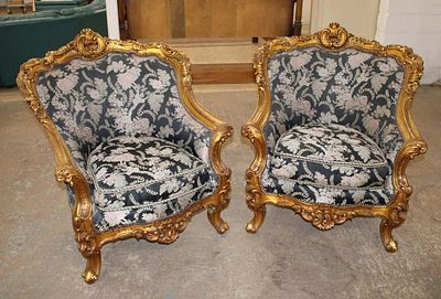 Pair of highly carved French style parlor chairs in the gold frame approx. 36" w x 38" d x 40" h