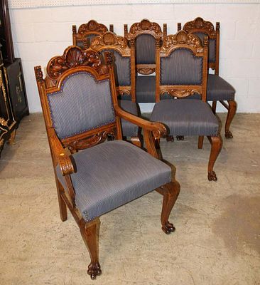 Set of 6 antique quartersawn oak paw foot dining room chairs with carved Lion head corners. Set