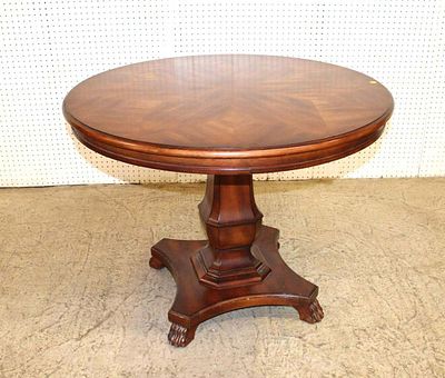 Burl mahogany 38" diameter center table with paw feet approx. 29" h