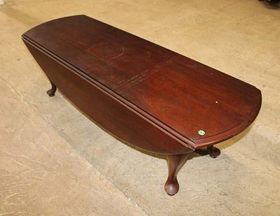 Solid cherry queen anne drop side coffee table, needs to be cleaned approx. 52" w x 18" d x 16" 