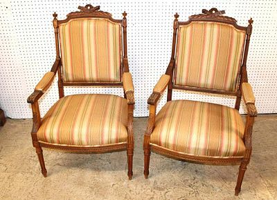 Pair of fancy French style decorator arm chairs. Pair of fancy carved French style walnut frame 