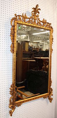 Beautiful highly carved gold gilt bevel glass deco mirror. Beautiful highly carved gold gilt 