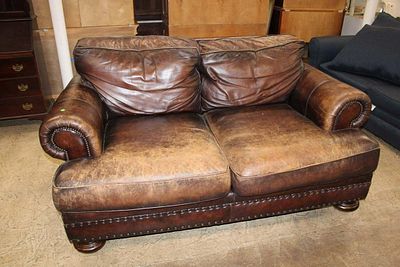 Bernhardt brown leather tacked loveseat, cushion leather is worn approx. 75" w x 48" d x 32" h 