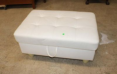 Modern design white leather style lift top storage ottoman, has small tear in leather approx. 