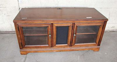 Contemporary mahogany 3 door media credenza approx. 56" w x 22" d x 26" h Condition: message or