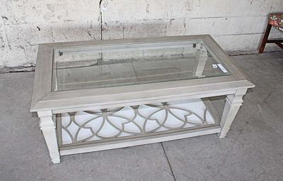 Contemporary glass top coffee table, broken fretwork base approx. 48" w x 25" d x 22" h