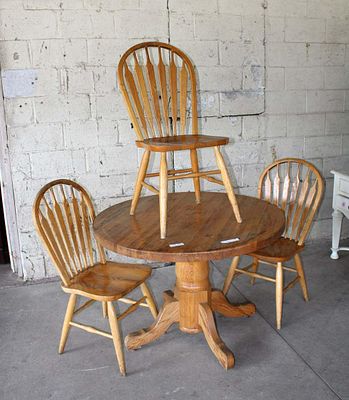 4pc oak breakfast table and 3 chairs approx. Table: 42" diameter x 30" h Chairs: 19" w x 19" d
