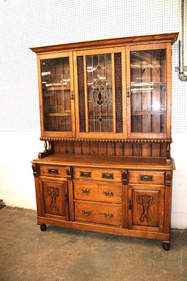Antique leaded glass step back oak cabinet approx. 60" w x 19" d x 84" h Condition: Message