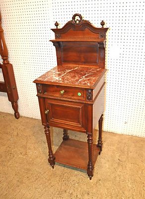 Antique French Victorian walnut bedside stand. Antique French highly carved Victorian walnut