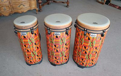 Set of 3 Remo graduating bongo drums. Set of 3 graduating bongo drums with handles, like new