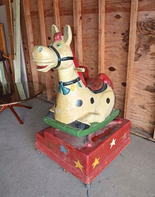 Vintage working coin operated child's ride. Vintage working metal mechanical coin operated
