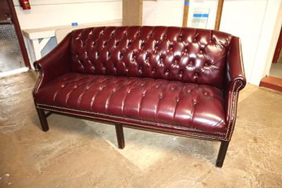 Chesterfield style leather like settee. Chesterfield style leather like button tuft settee in