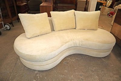 Modern design arched back upholstered sofa. Modern design arched back upholstered decorator sofa 