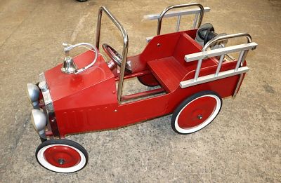 Vintage red metal pedal car fire ladder truck approx. 17" w x 38" d x 21" h