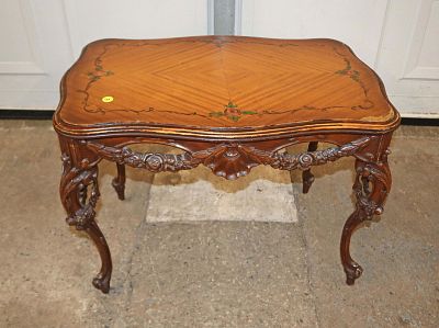 Semi antique carved walnut table. Semi antique carved walnut paint decorated top table, has wear 