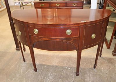 Baker half moon mahogany spade foot sideboard. Quality Baker Furniture banded mahogany half moon