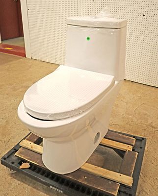 New Swiss Madison dual flush toilet. New in plastic Swiss Madison dual flush toilet with