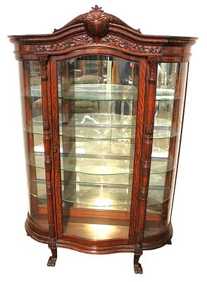 Antique R.J. Horner carved serpentine paw foot cabinet. Antique R.J. Horner heavily carved oak 