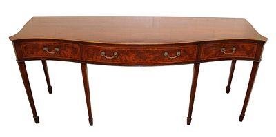 Kittinger style serpentine spade foot buffet or console. Quality semi antique burl mahogany 