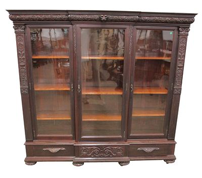 Antique RJ Horner style wavy glass carved bookcase. Beautiful antique solid mahogany highly 