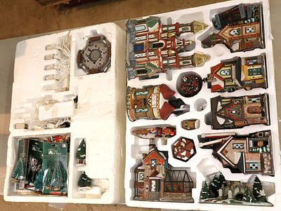Large lighted Christmas porcelain village with extras in box. Box 27.5 x 19.5" x 8"