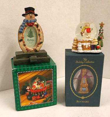 2 snow globes, stocking hanger, Rochard Xmas ornament. 4 piece lot: 2 snow globes, stocking 