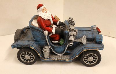 Santa in car, approx. 6.5"h x 10"l x 4.5"w