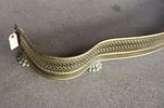 Antique brass paw foot fireplace fender, structurally sound, does show patina. 6.5"h x 49"w x 9.5"dImage - 1